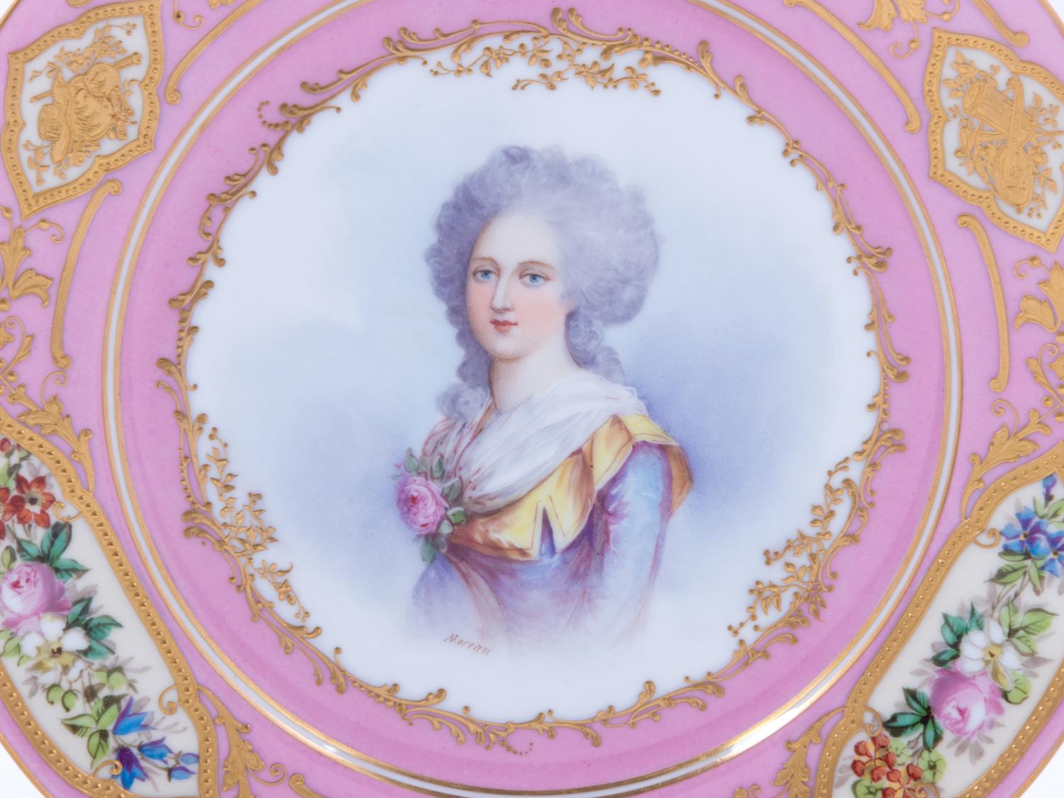 A Pair of Sèvres Painted and Parcel Gilt Pink-Ground Porcelain Plates