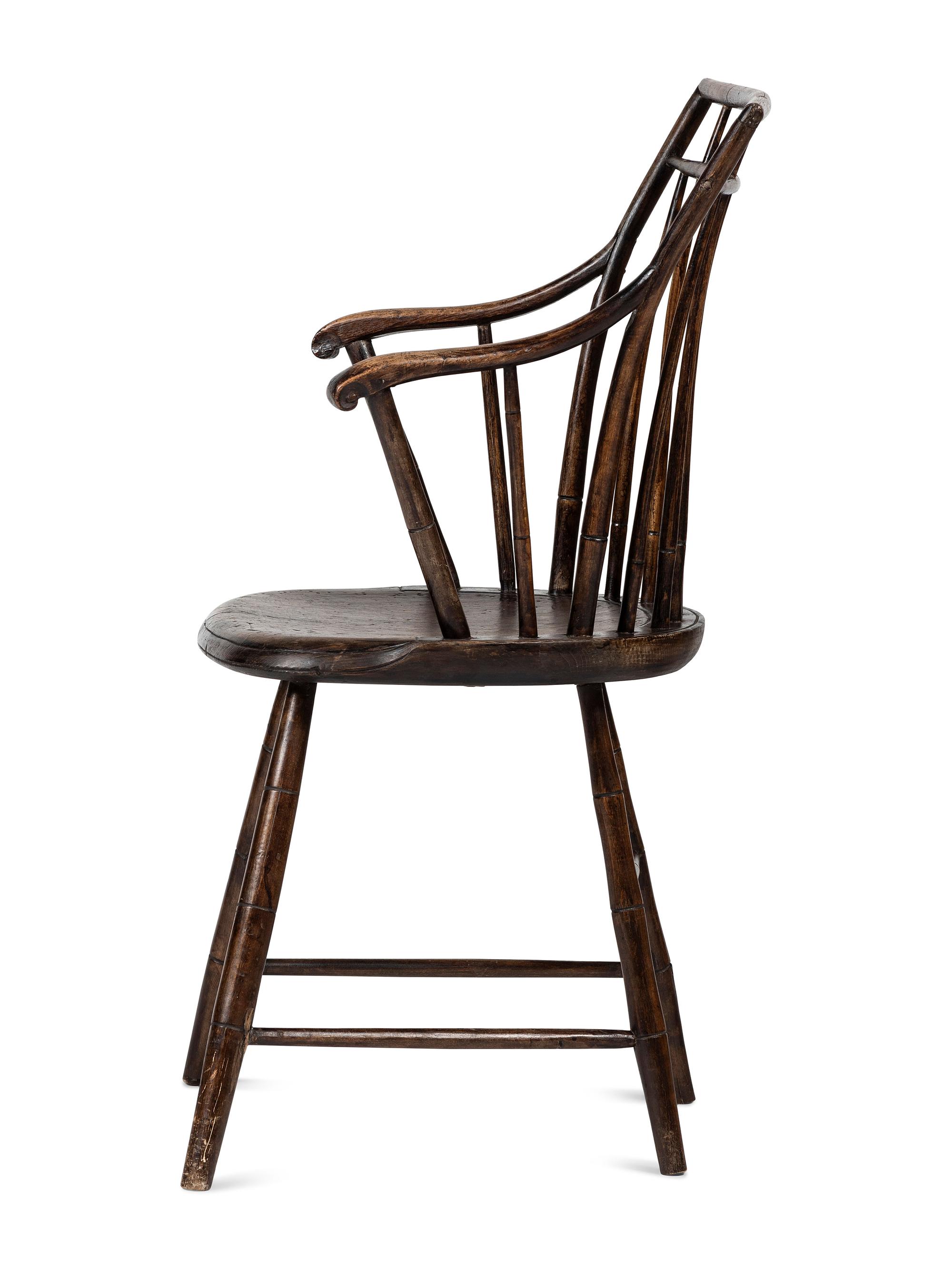 A Birdcage Windsor Scroll-Carved Armchair