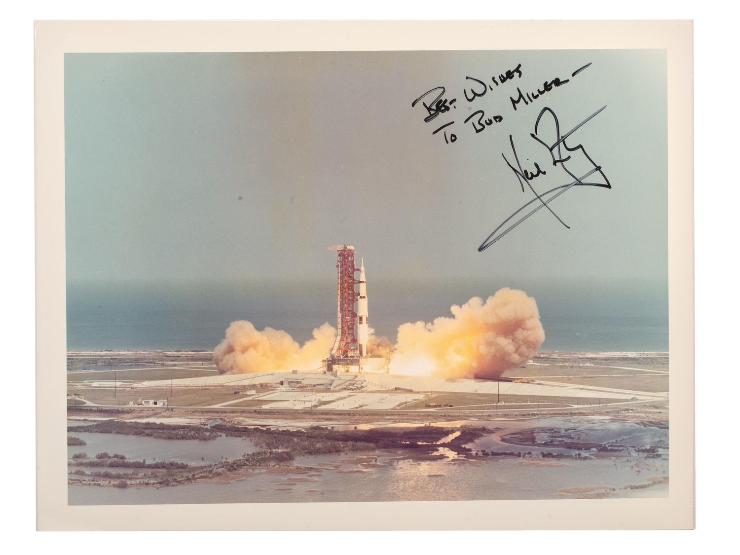 [SPACE & EXPLORATION]. ARMSTRONG, Neil (1930-2012). Signed photograph showing the Apollo II lift off from Cape Canaveral, Florida.