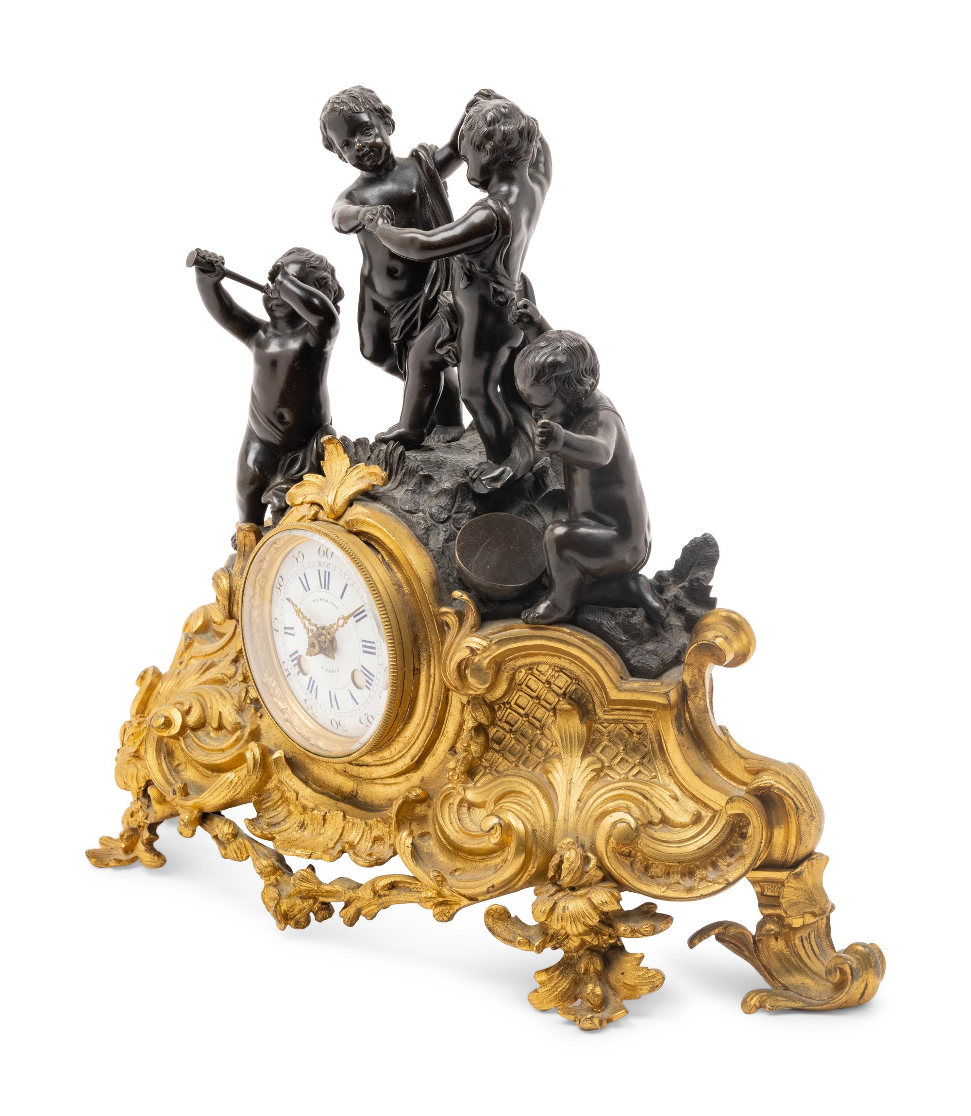 A French Gilt and Patinated Bronze Figural Mantel Clock