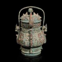 A Chinese archaistic bronze covered ritual wine vessel, You 青銅提梁卣