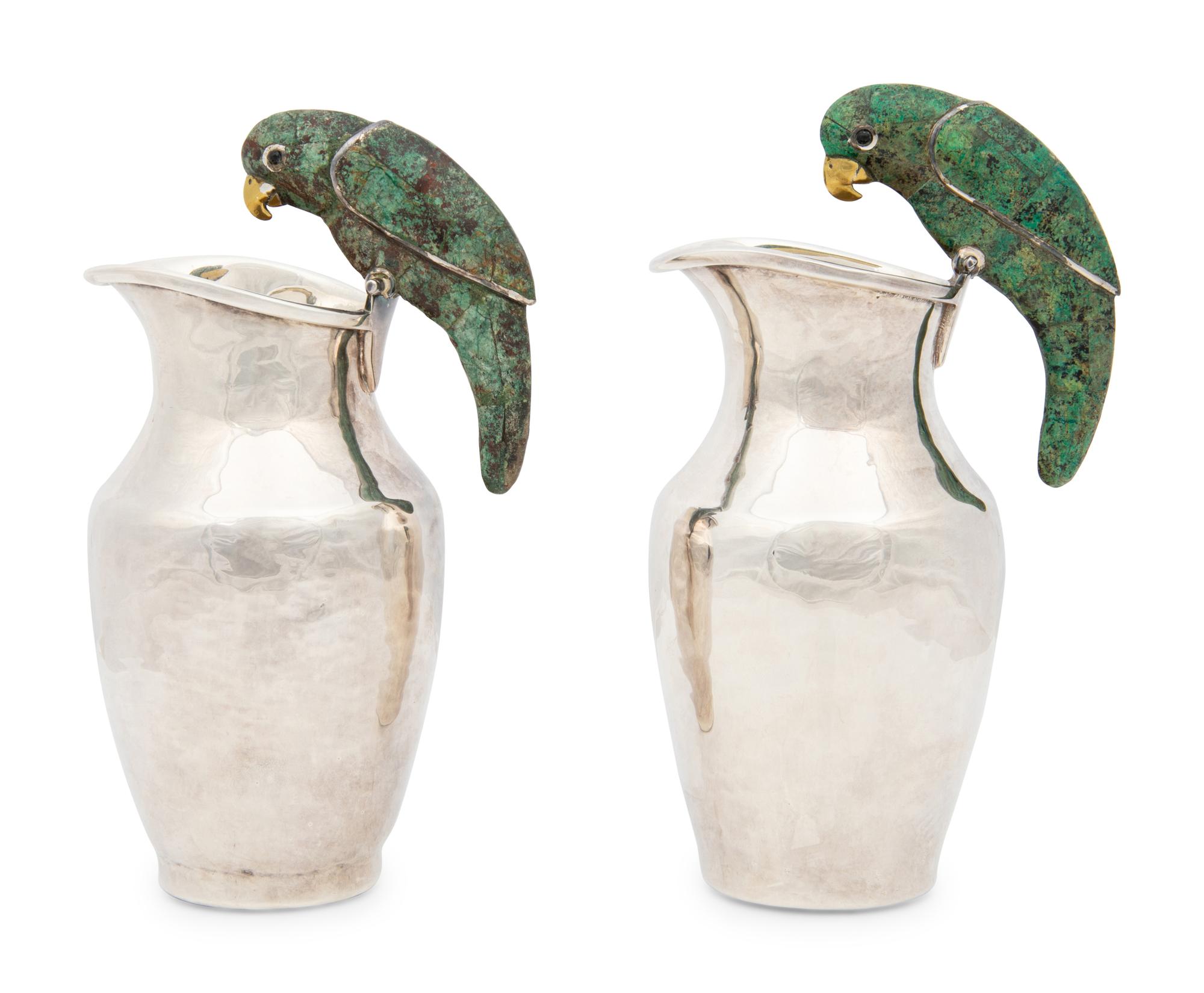 A Pair of Los Castillo Silver Pitchers