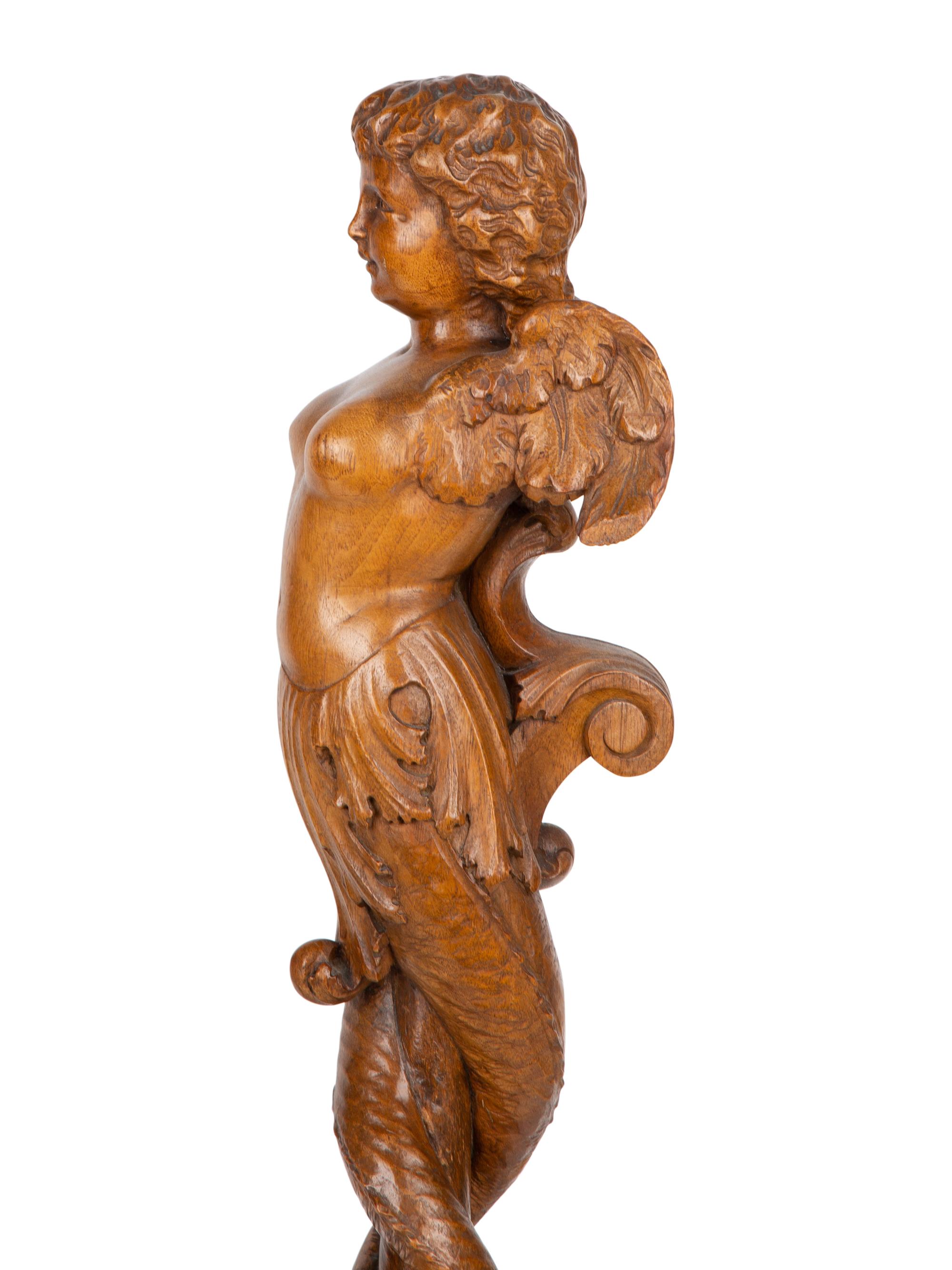 A Pair of Italian Carved Walnut Putti on Fluted Bases — 18TH/19TH CENTURY