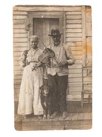 [EARLY PHOTOGRAPHY]. Real photo postcard of a formerly enslaved couple, incl. a Civil War veteran.
