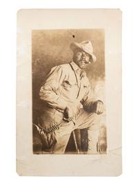 [AFRICAN AMERICANA] -- [EARLY PHOTOGRAPHY]. Real photo postcard of African American sergeant smoking cigar. Ca 1910s.