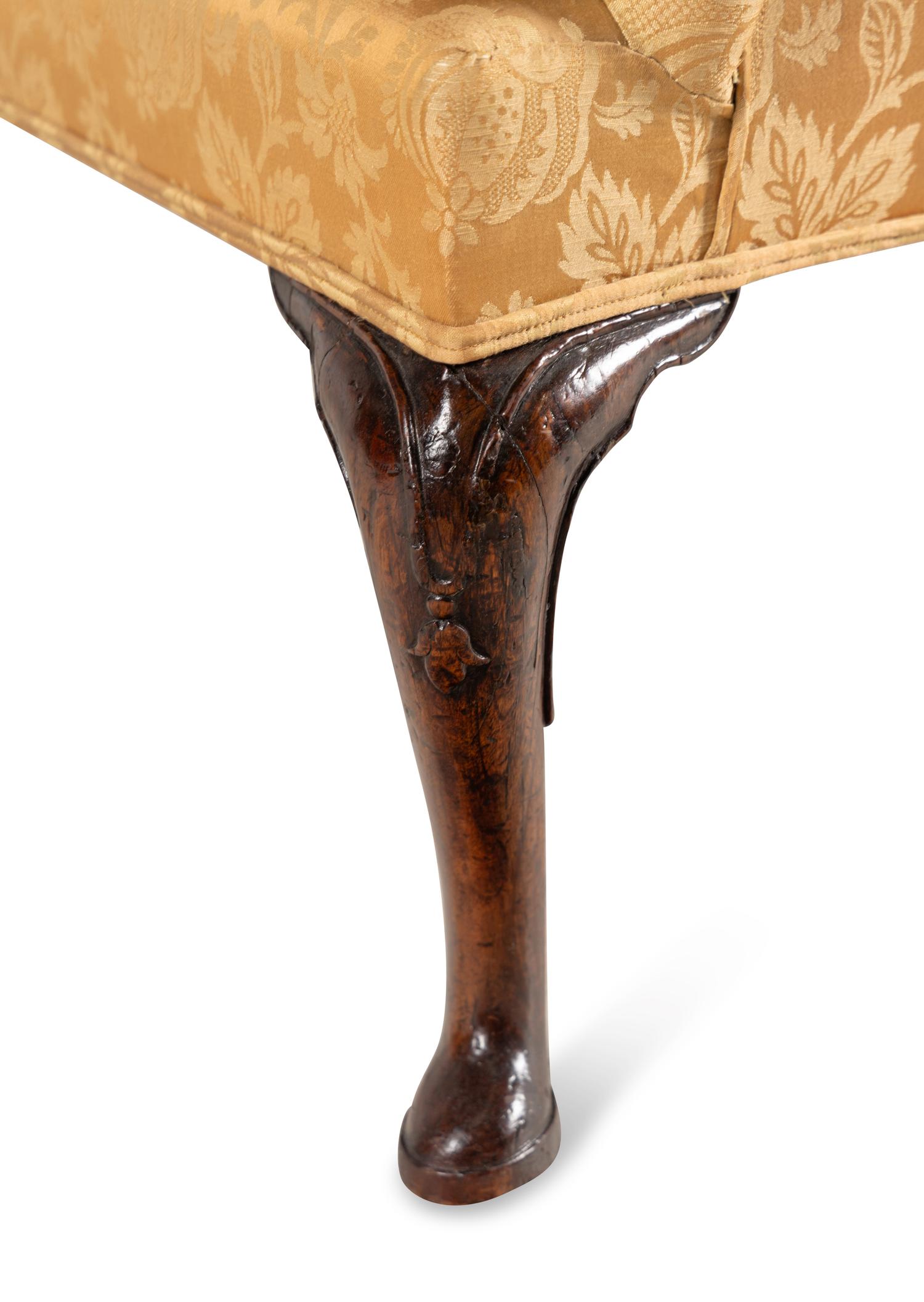 A George I Walnut Wingback Armchair