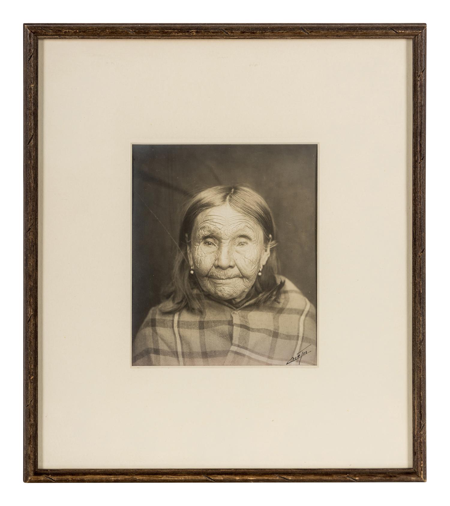 Edward S. Curtis (1868-1952) Untitled portrait (Native American Woman in Plaid Shawl,) c. 1900