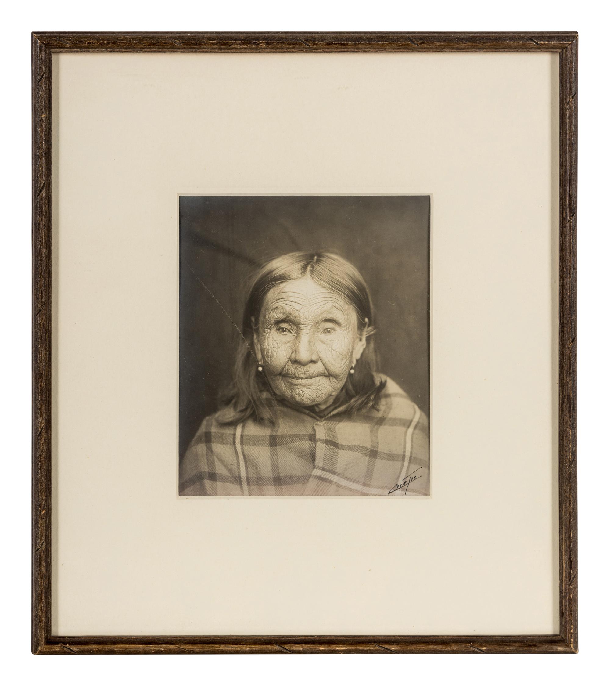 Edward S. Curtis (1868-1952) Untitled portrait (Native American Woman in Plaid Shawl,) c. 1900