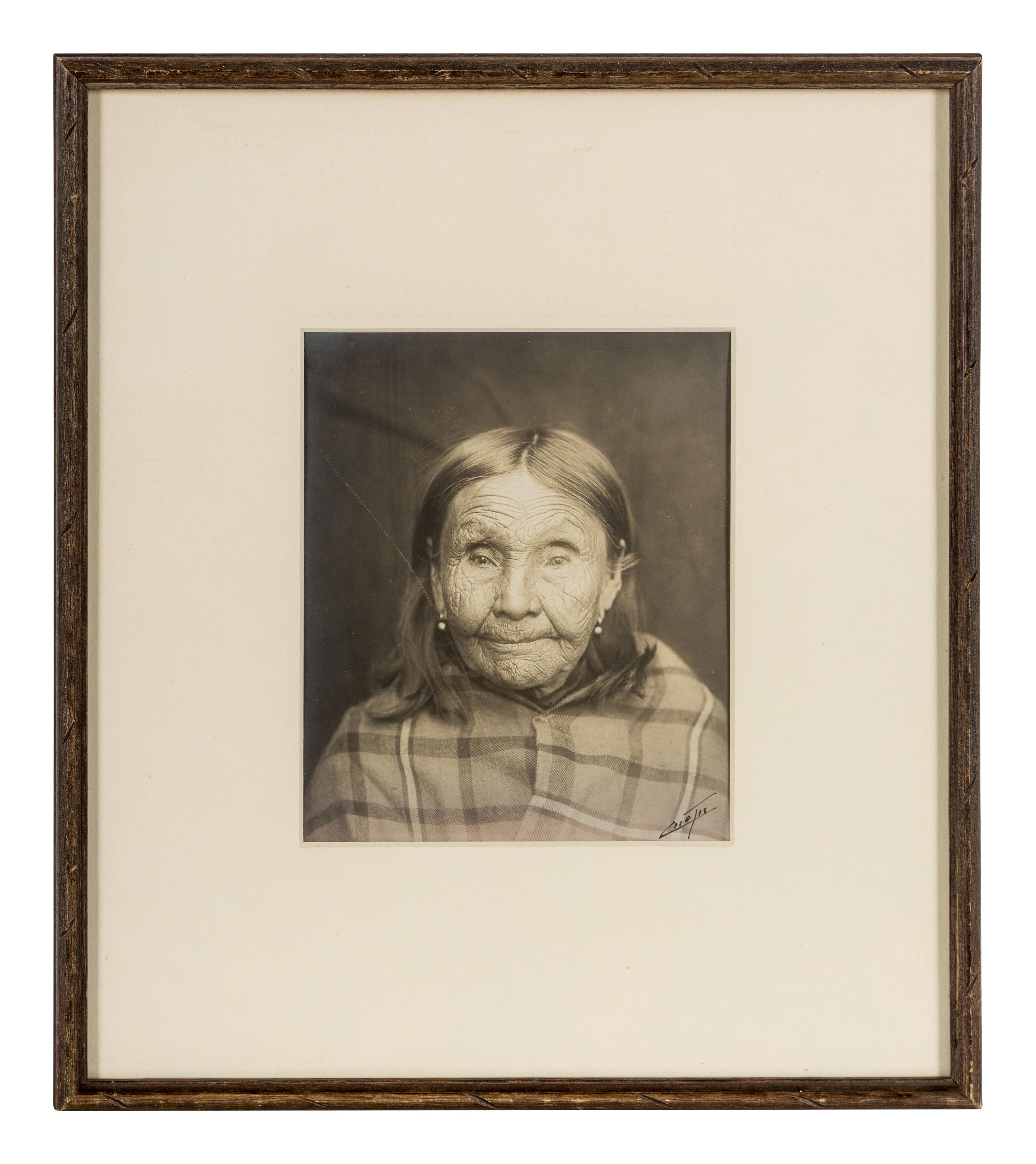 Edward S. Curtis (1868-1952) Untitled portrait (Native American Woman in Plaid Shawl,) c. 1900