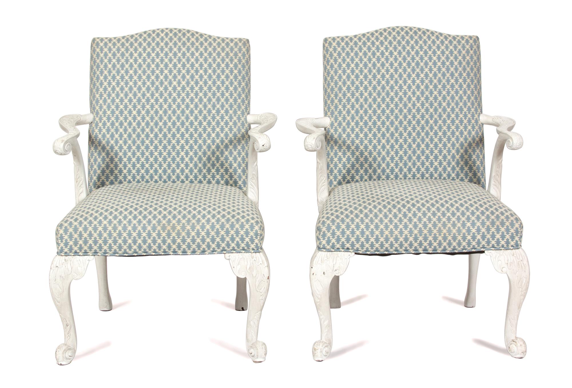A Pair of George III Style Carved White Painted Open Armchairs Height 44 x width 26 x depth 24 inches. — 20TH CENTURY