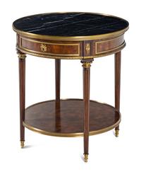 A Louis XVI Style Gilt Metal Mounted Marble-Top Mahogany Guéridon