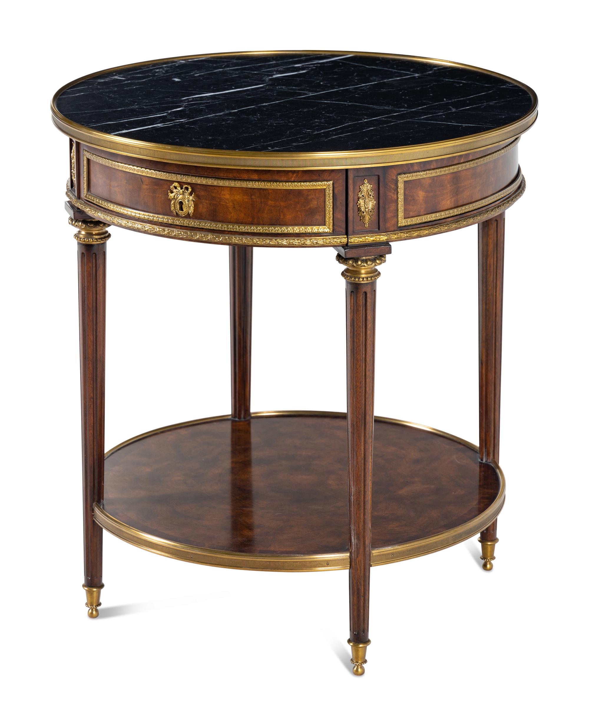 A Louis XVI Style Gilt Metal Mounted Marble-Top Mahogany Guéridon
