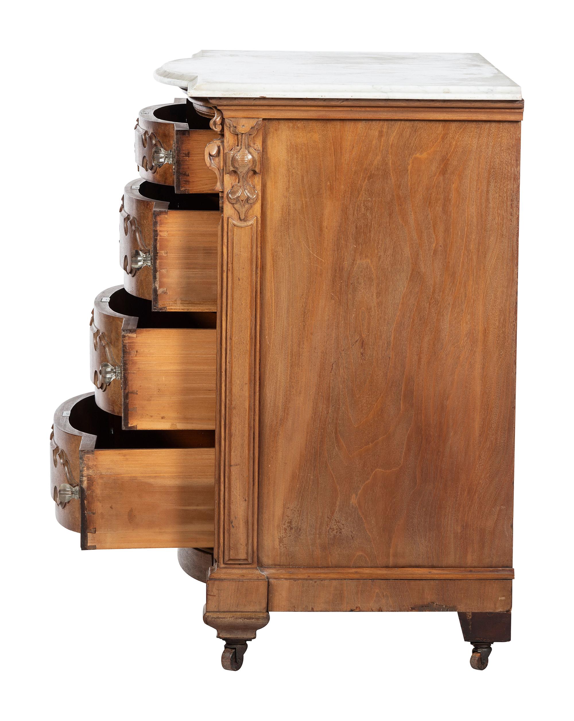 A Victorian Walnut Marble-Top Chest of Drawers