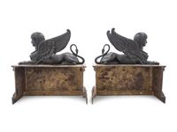 A Pair of Empire Gilt and Patinated Bronze Sphinx Ornaments