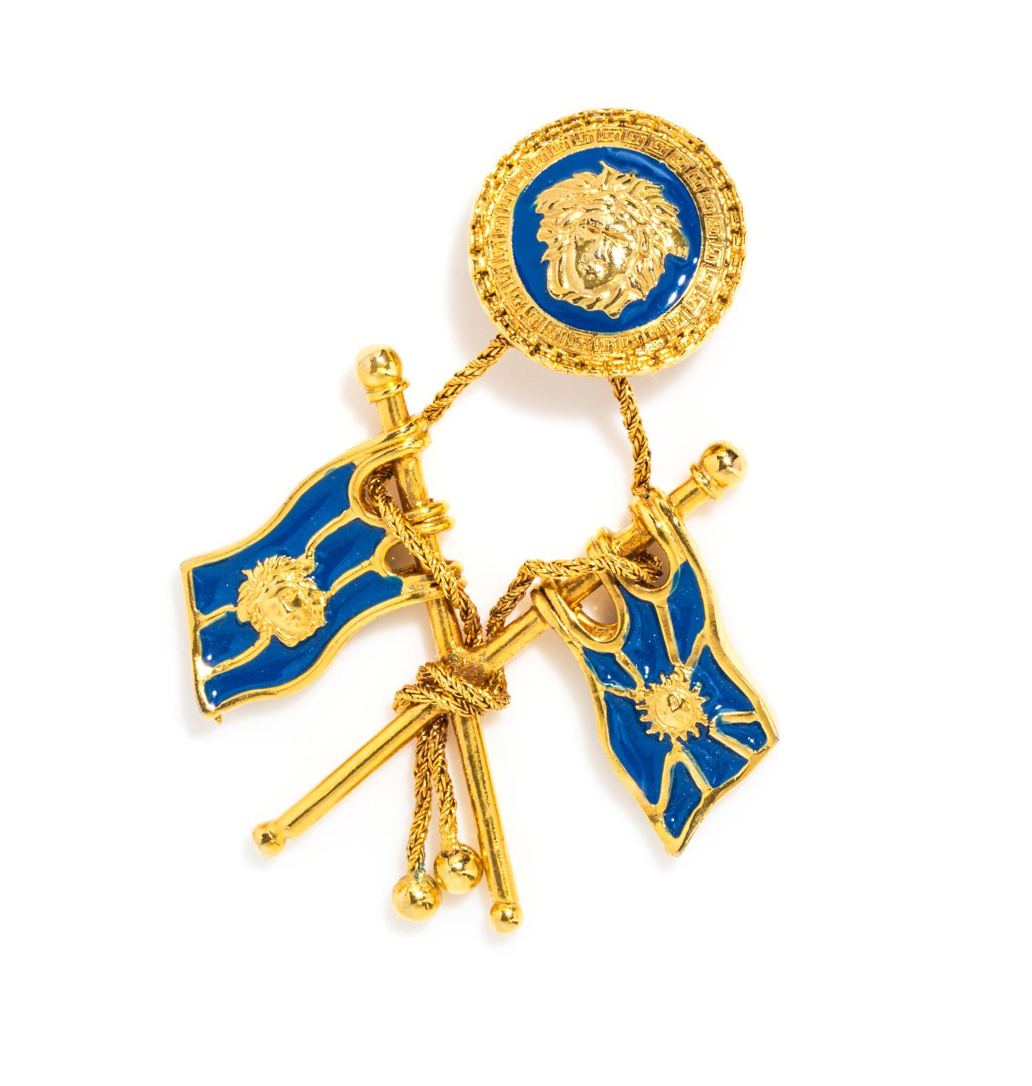 A Gianni Versace Single Blue Enamel Flag Earclip, 2.5" x 3.5".
