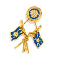 A Gianni Versace Single Blue Enamel Flag Earclip, 2.5" x 3.5".