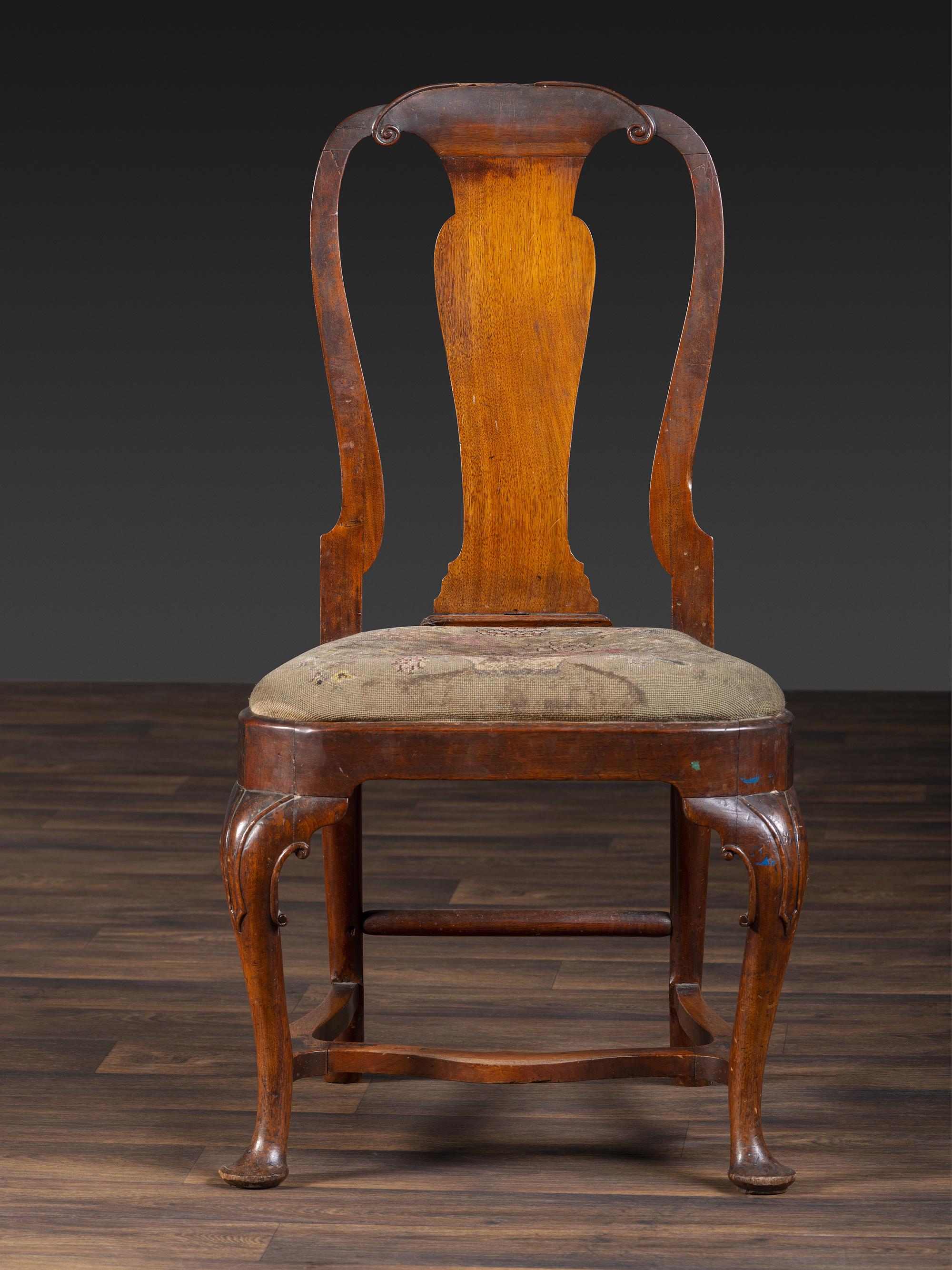 A Queen Anne Volute Carved Walnut Flat-Stretcher Pad-Foot Side Chair