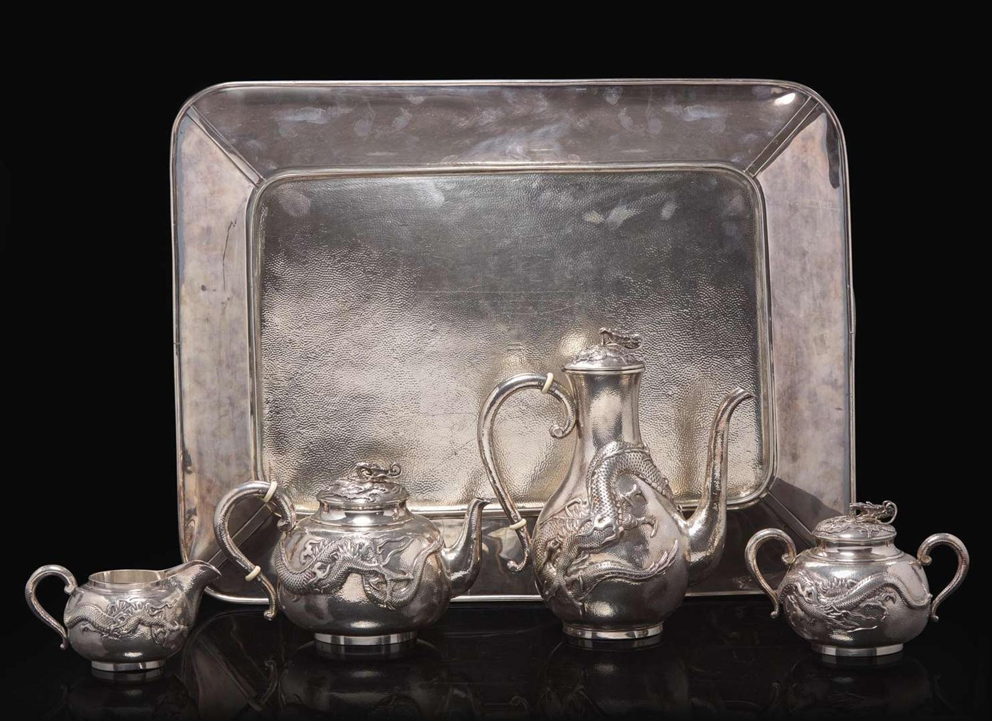 An impressive Japanese export silver four-piece "Dragon" tea and coffee service with tray, retailed by Arthur & Bond, Yokohama, late 19th/early 20th century 日式銀質咖啡器茶具四件及托盤 十九世紀末或二十世紀初
