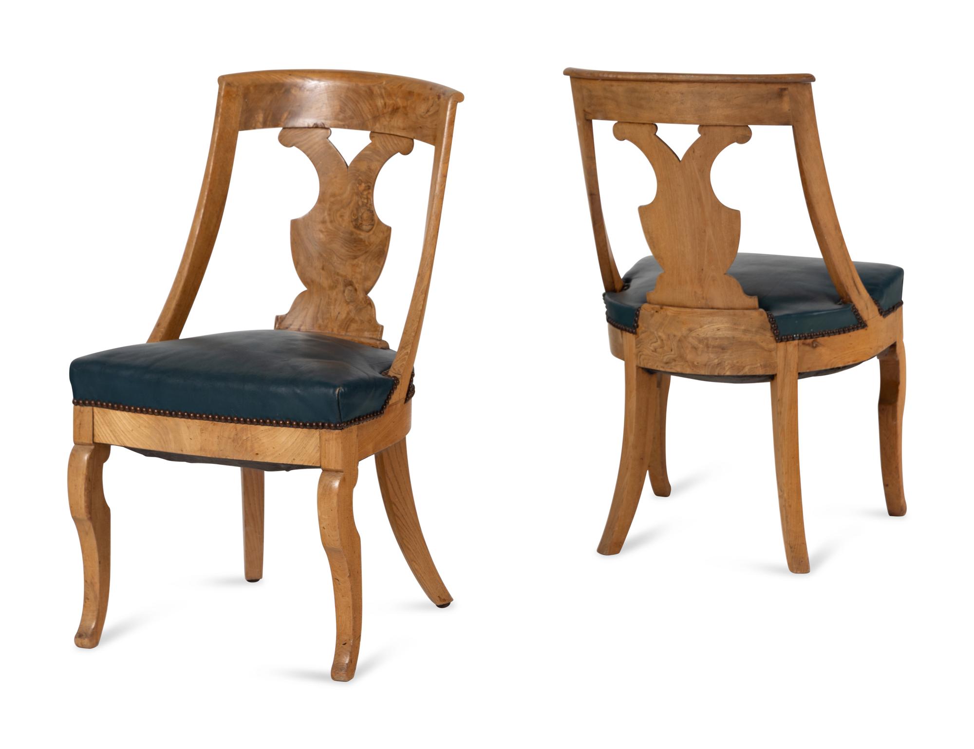 A Set of Six German or Austrian Walnut Dining Chairs
