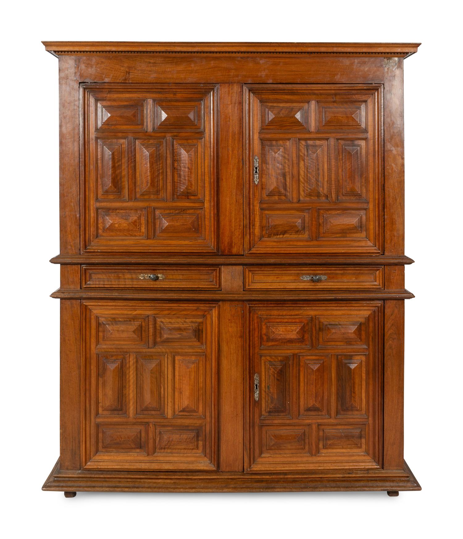 A Large Italian Baroque Carved Walnut Deux Corps Cabinet