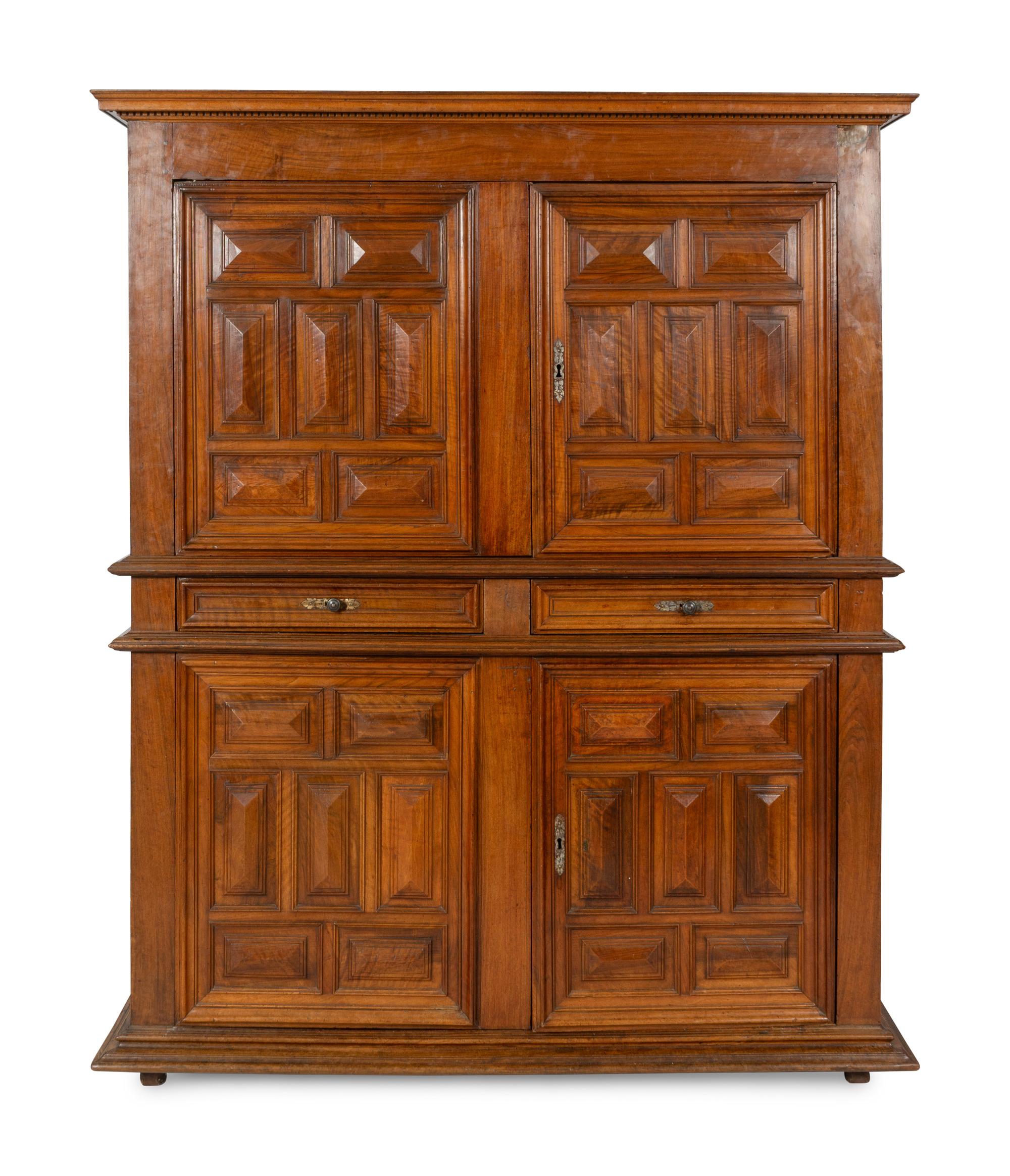 A Large Italian Baroque Carved Walnut Deux Corps Cabinet