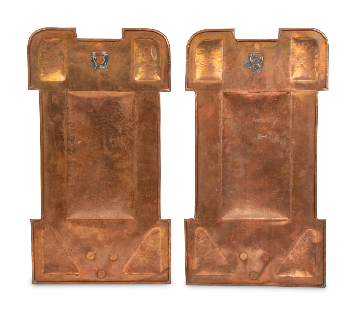 A Pair of Arts and Crafts Hammered Copper Sconces