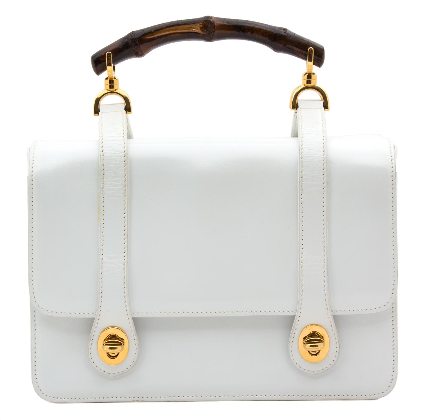 A Gucci White Leather Double Sided Handbag, 9" x 6.5" x 4.5".