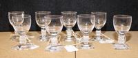 A Set of Eight Lalique Glass Cordials Height 3 1/4 inches.