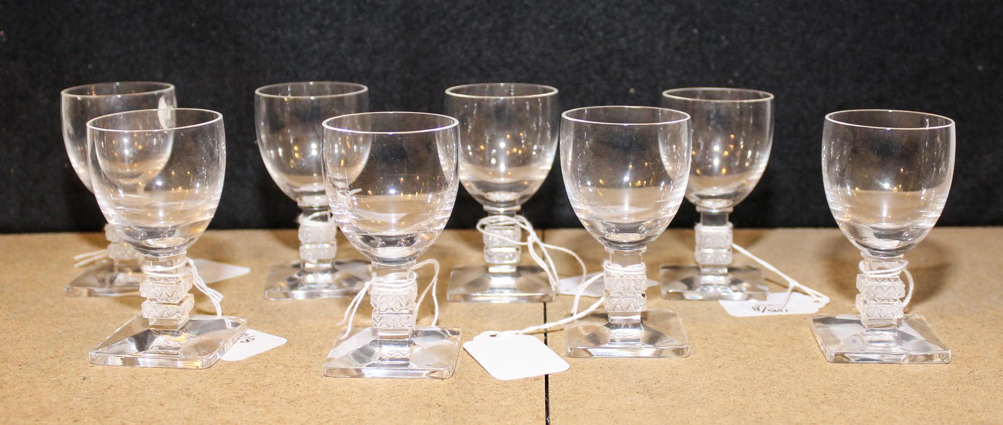 A Set of Eight Lalique Glass Cordials Height 3 1/4 inches.