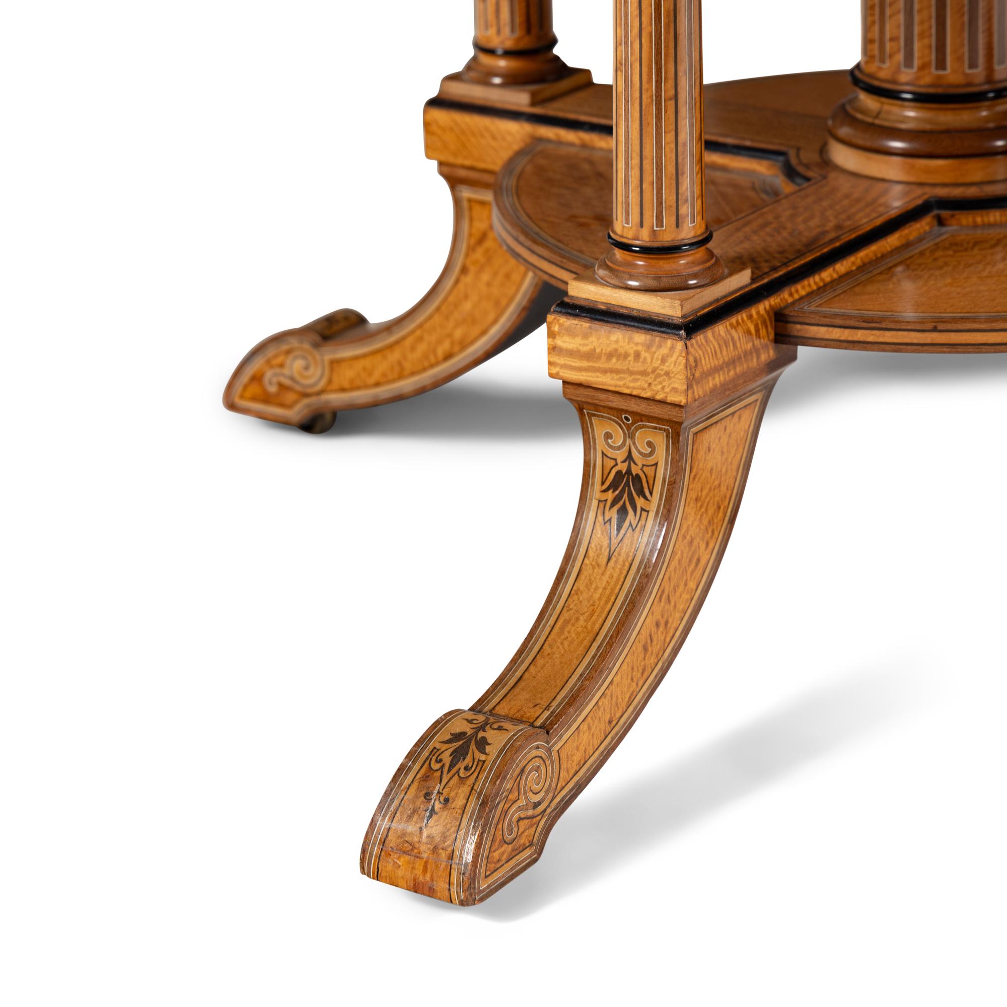 An English Part-Ebonized Satinwood, Harewood and Marquetry Center Table