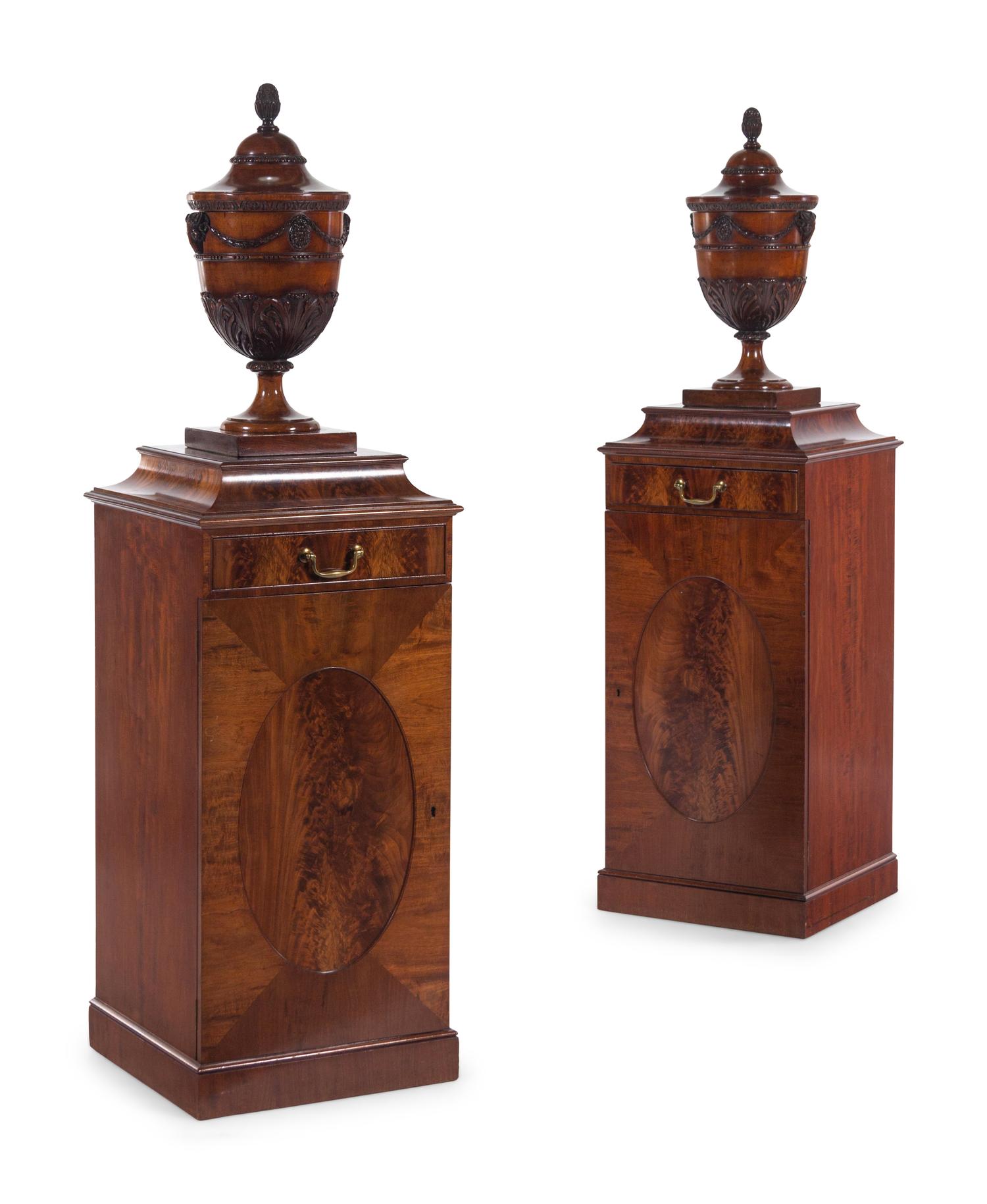 A Pair of Edwardian Style Mahogany Cutlery Urns on Pedestals