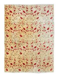 A Floral Patterned Wool Rug — 20TH CENTURY