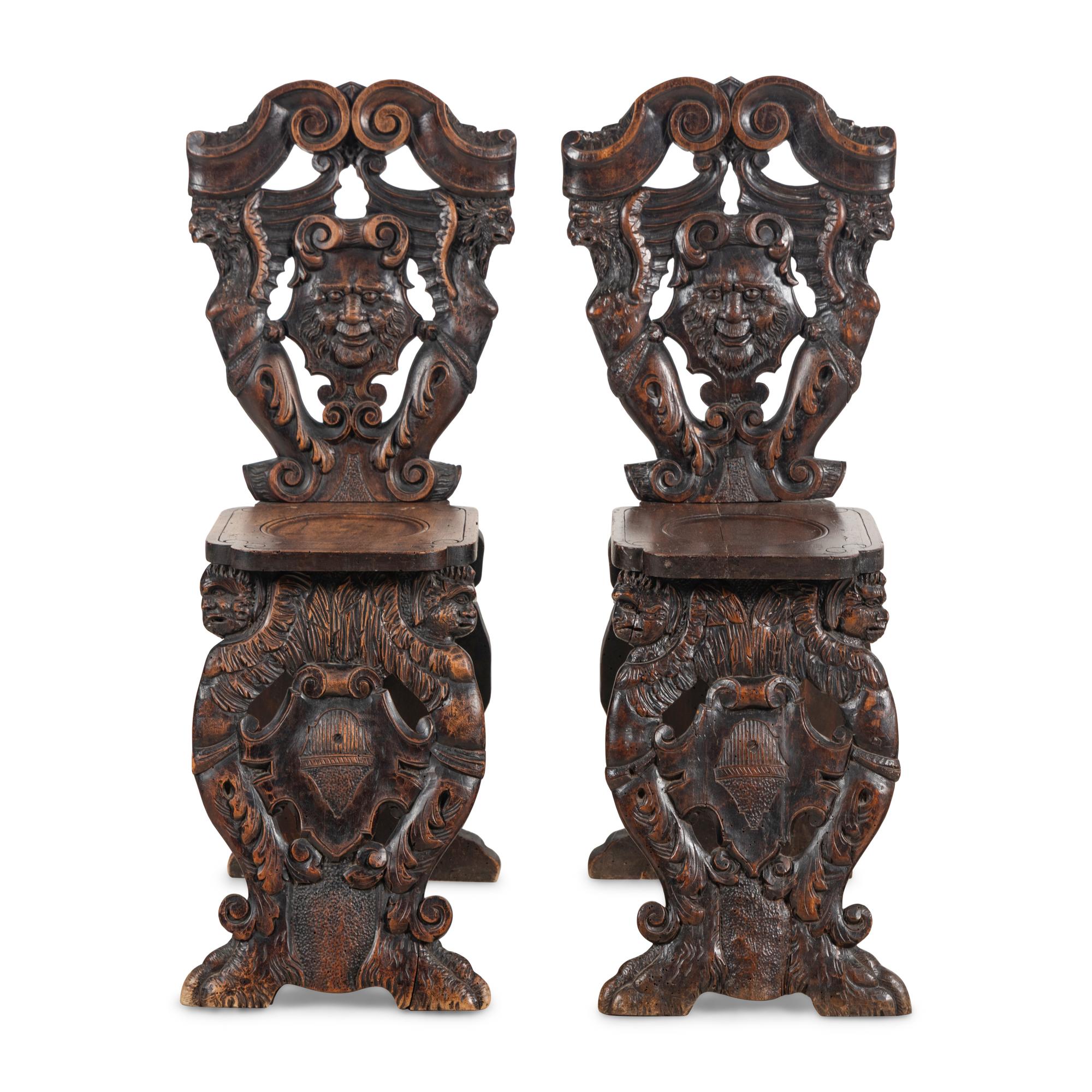 A Pair of Italian Carved Walnut Sgabello Chairs