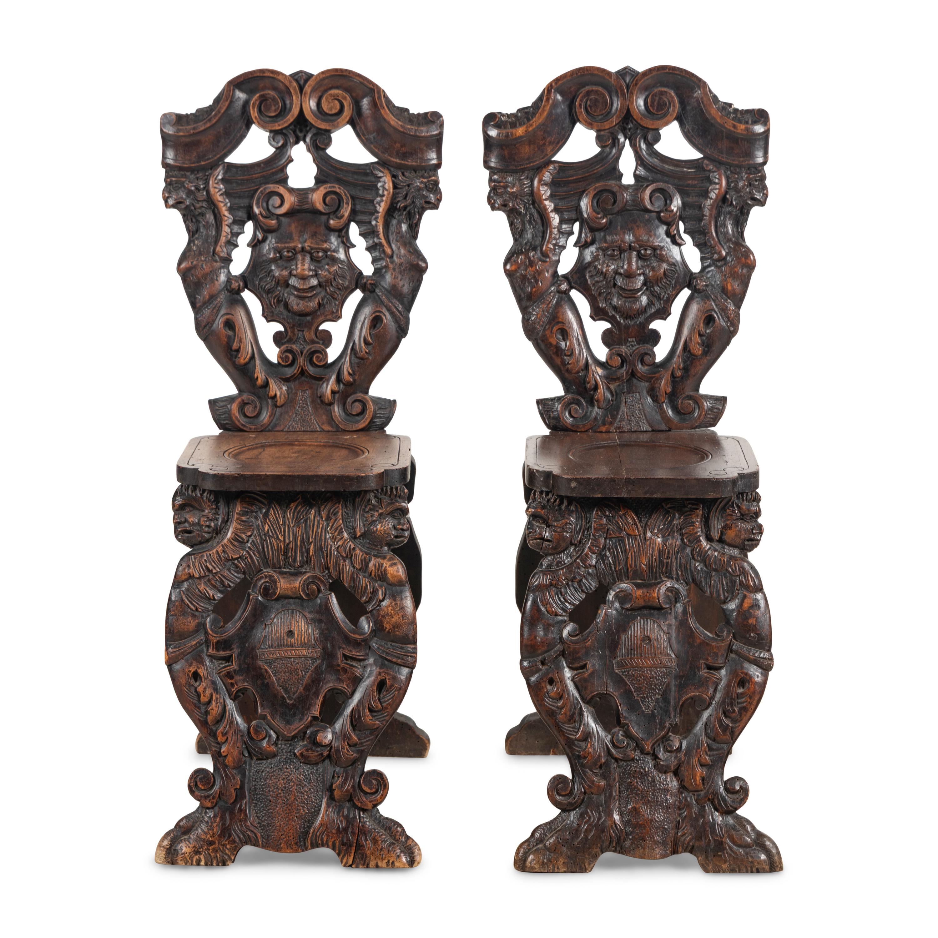A Pair of Italian Carved Walnut Sgabello Chairs
