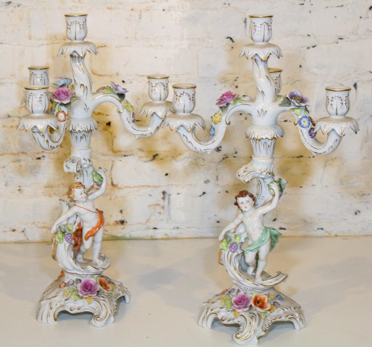 A Pair of German Figural Four Light Candelabra. Height 19 1/2 inches.