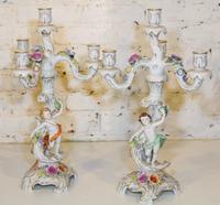 A Pair of German Figural Four Light Candelabra. Height 19 1/2 inches.