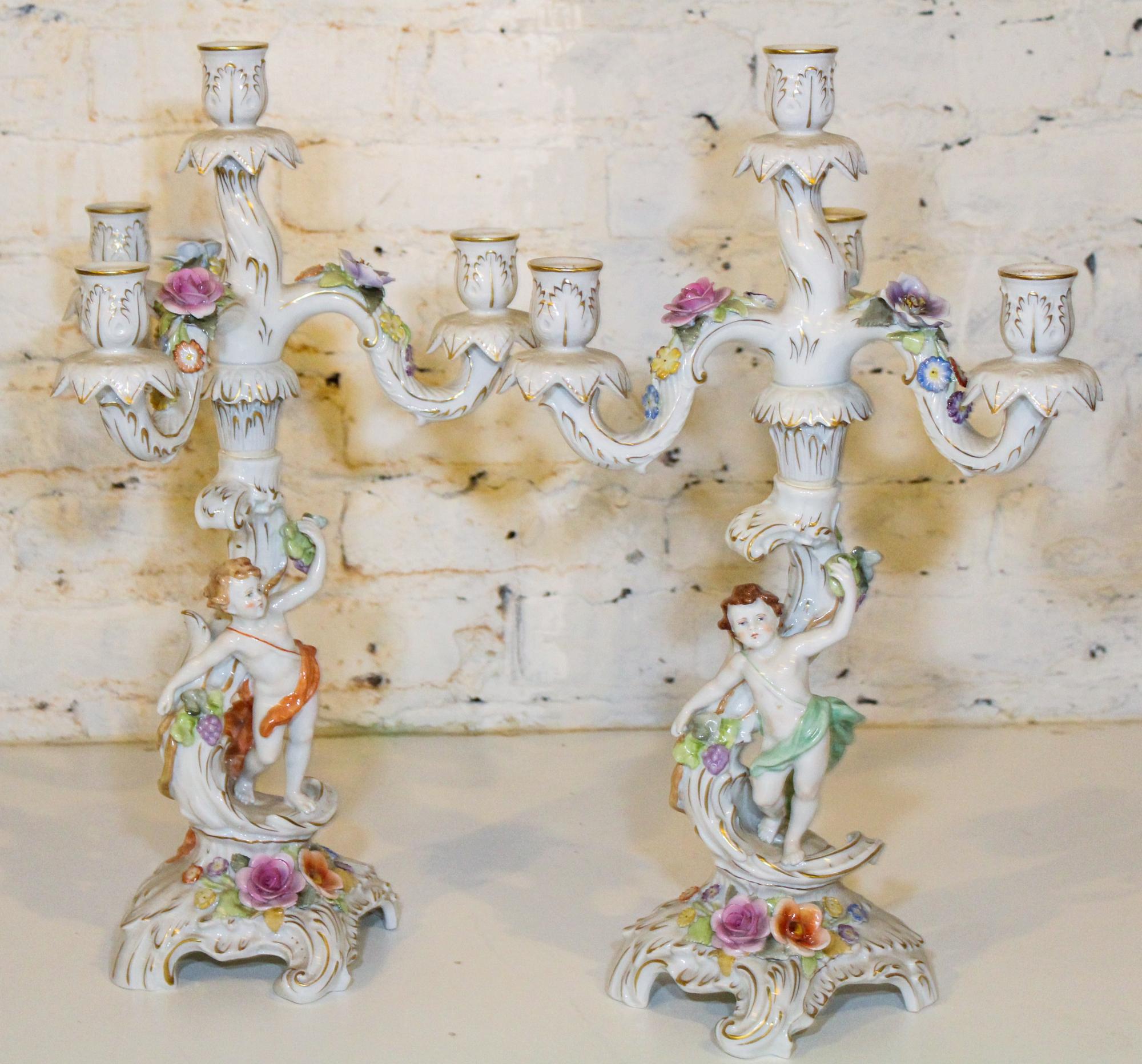 A Pair of German Figural Four Light Candelabra. Height 19 1/2 inches.