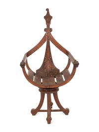 An Italian Carved Mahogany Gondola Chair with Swivel Seat