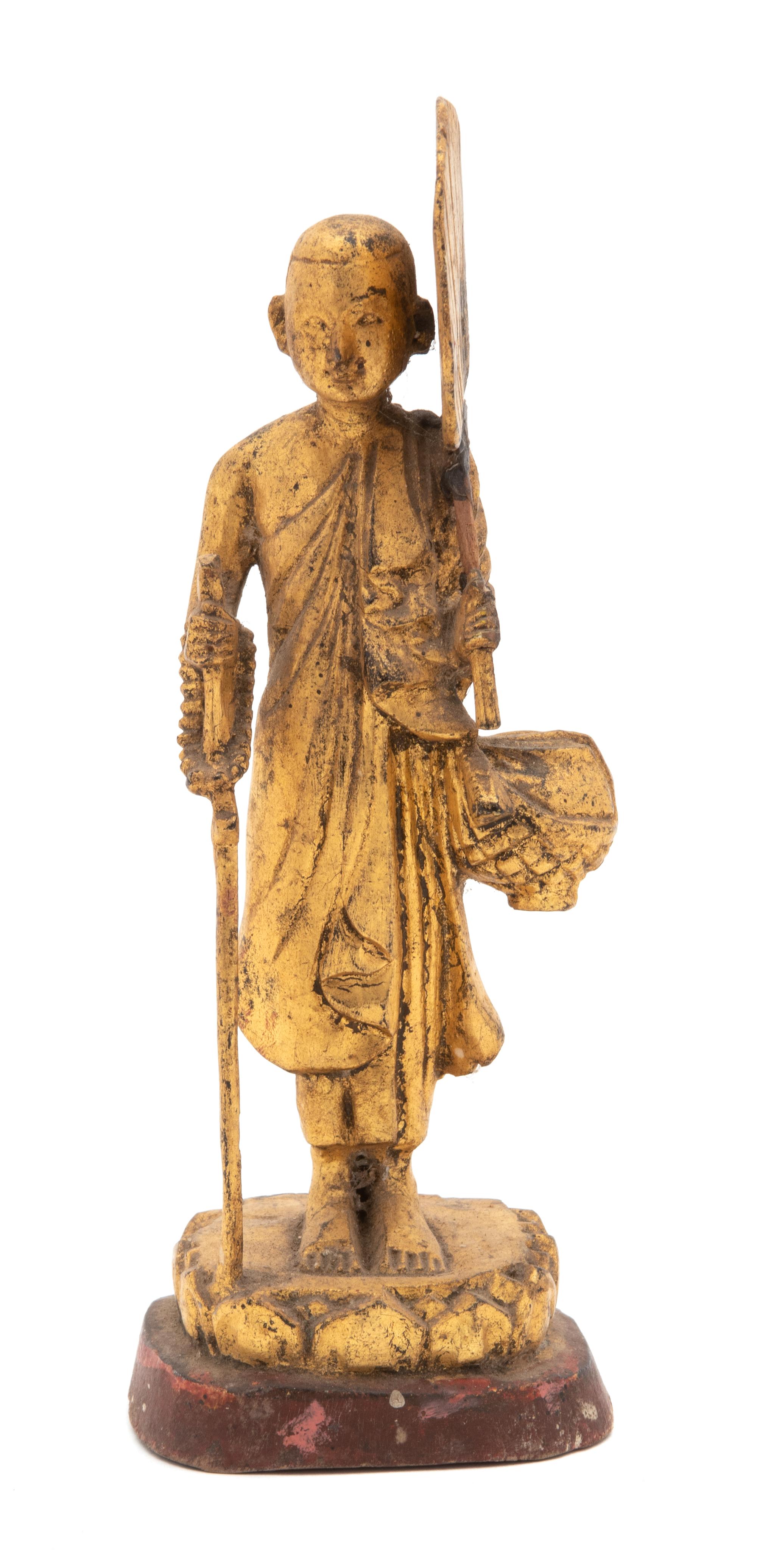 A Thai Gilt Lacquered Wood Figure of a Standing Monk Height 8 inches. — 20TH CENTURY