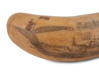 An Unusually Large Scrimshaw Tooth Depicting A Seaport