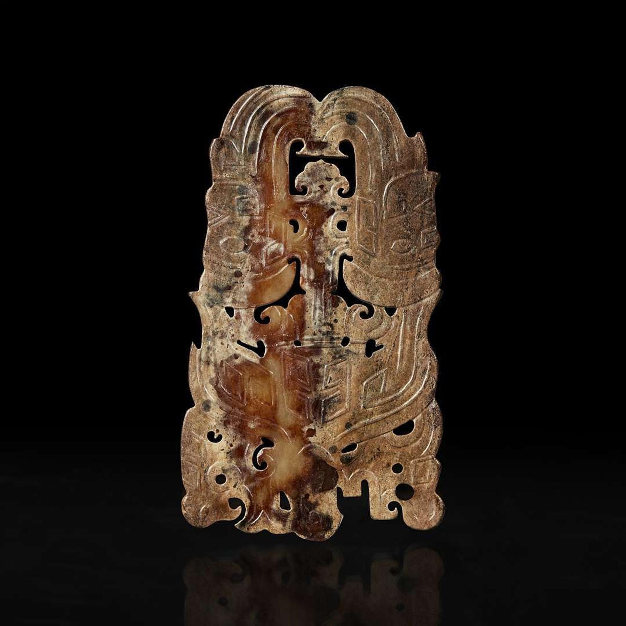 A Chinese archaistic carved beige and brown jade plaque 高古风格棕黄玉佩