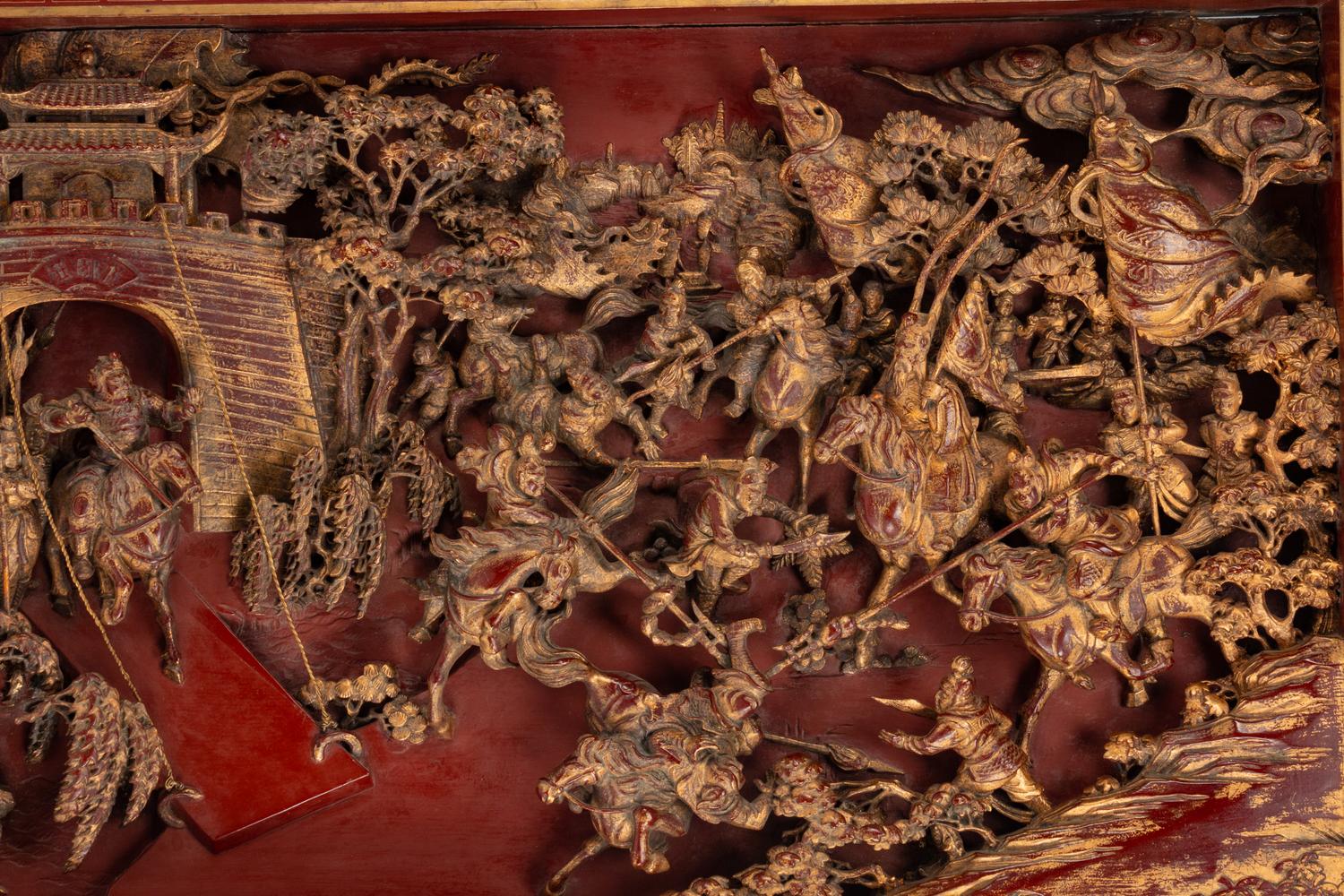 A Large Chinese Pierce-Carved Giltwood Panel Depicting a Battle Scene