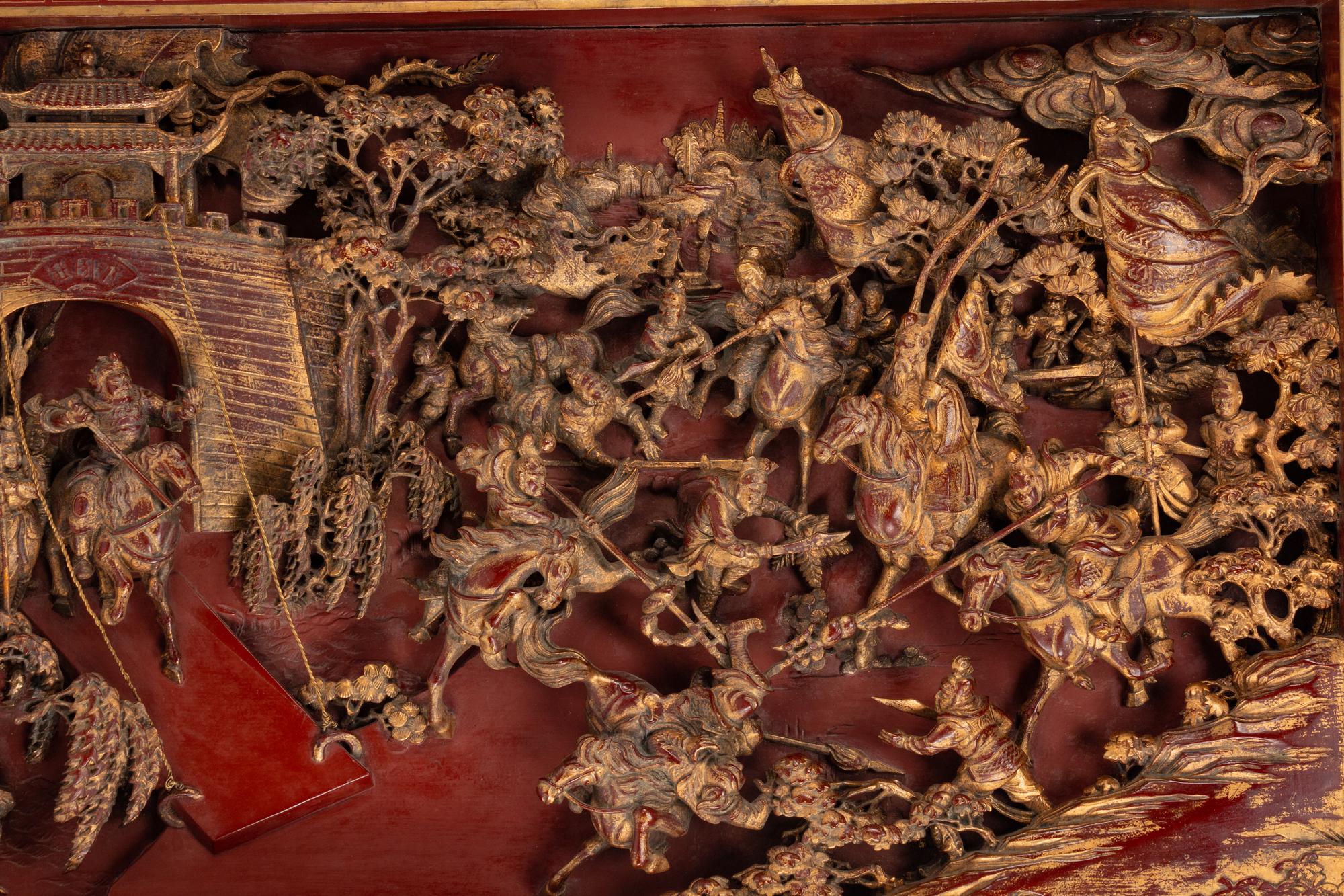 A Large Chinese Pierce-Carved Giltwood Panel Depicting a Battle Scene