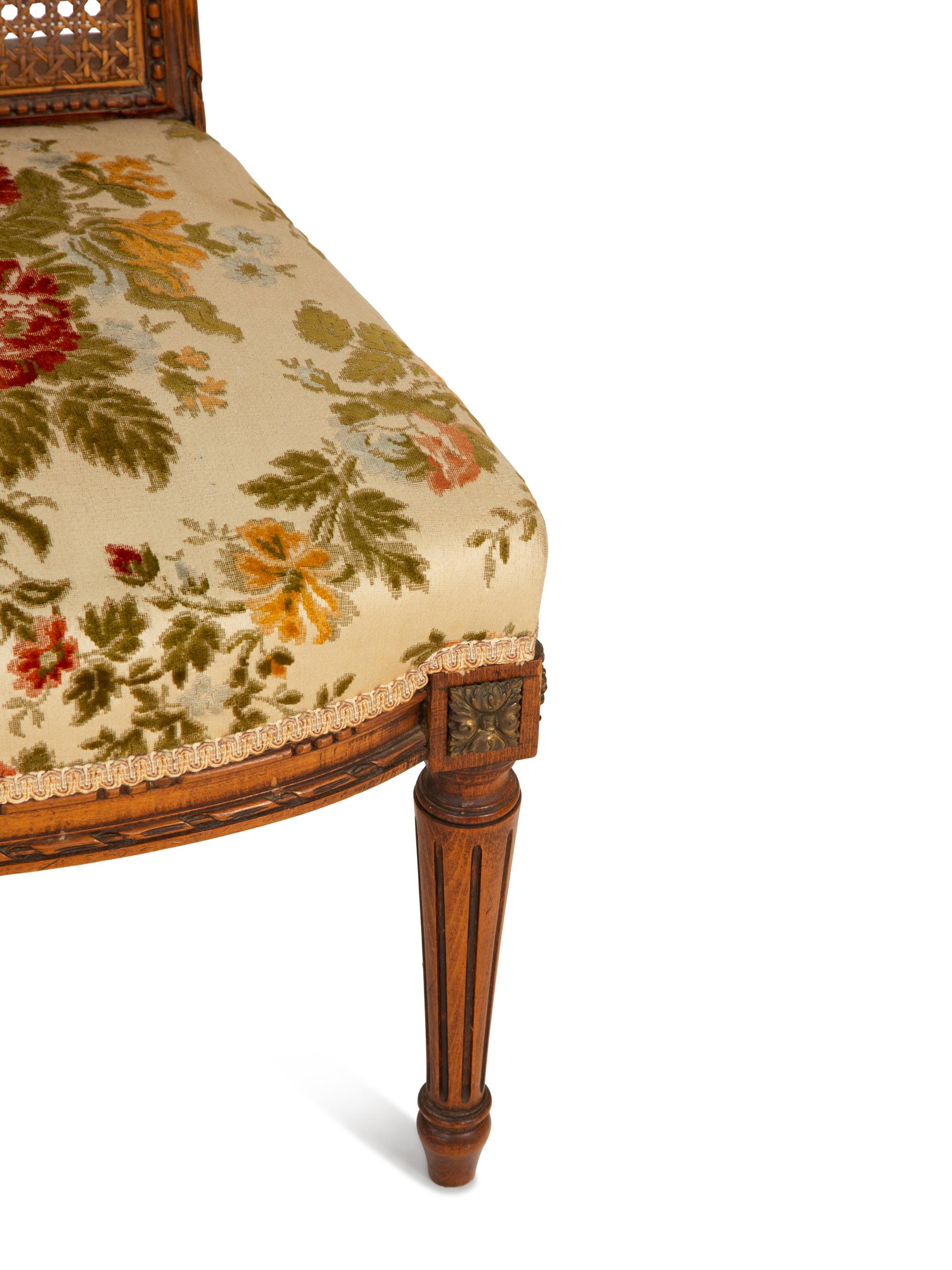 A Pair of Italian Louis XVI Style Gilt Metal Mounted Mahogany and Canework Side Chairs