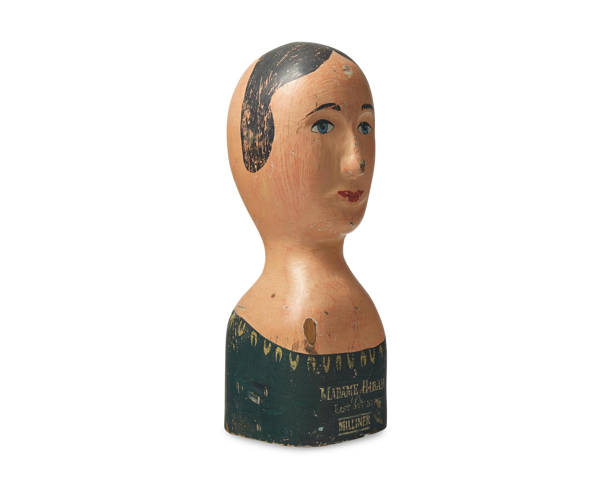 A Carved and Painted Milliner's Model Head