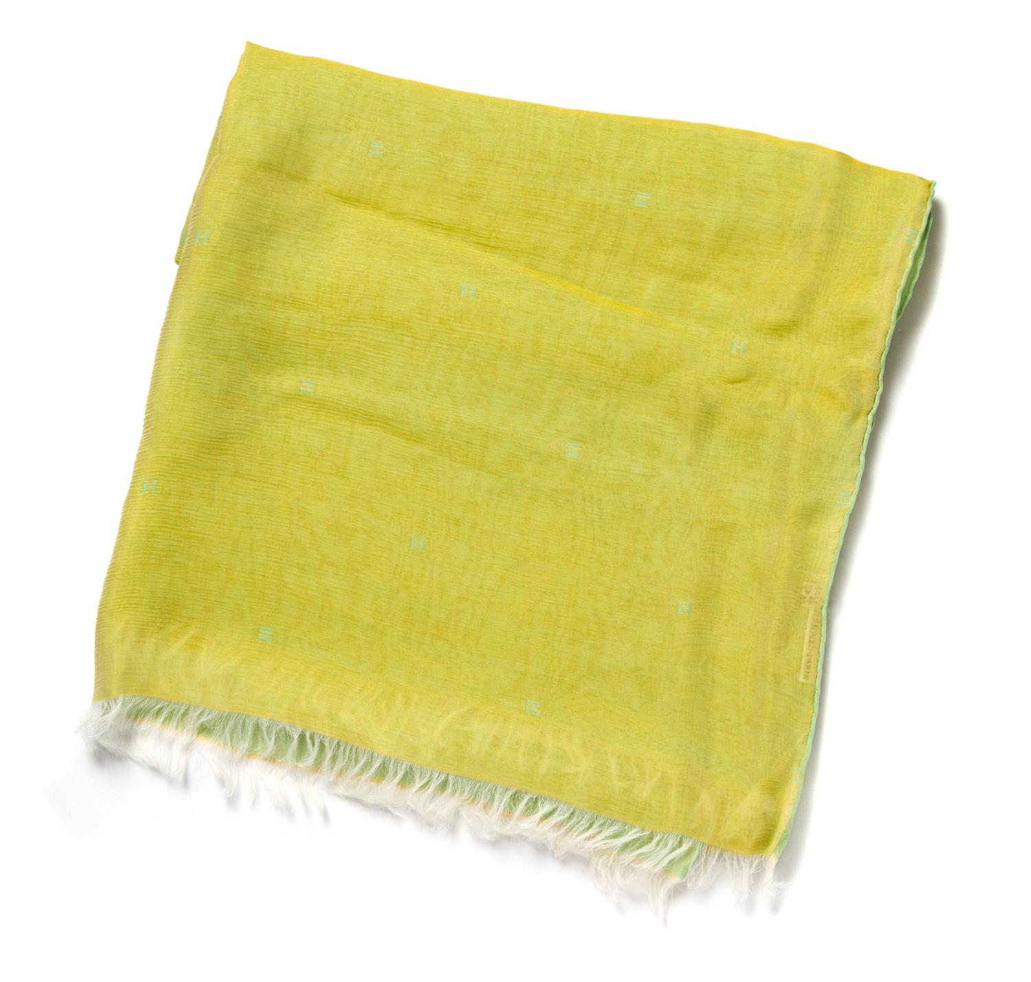 An Hermes Lime Silk Chiffon Oblong Scarf, 68 x 26 inches.