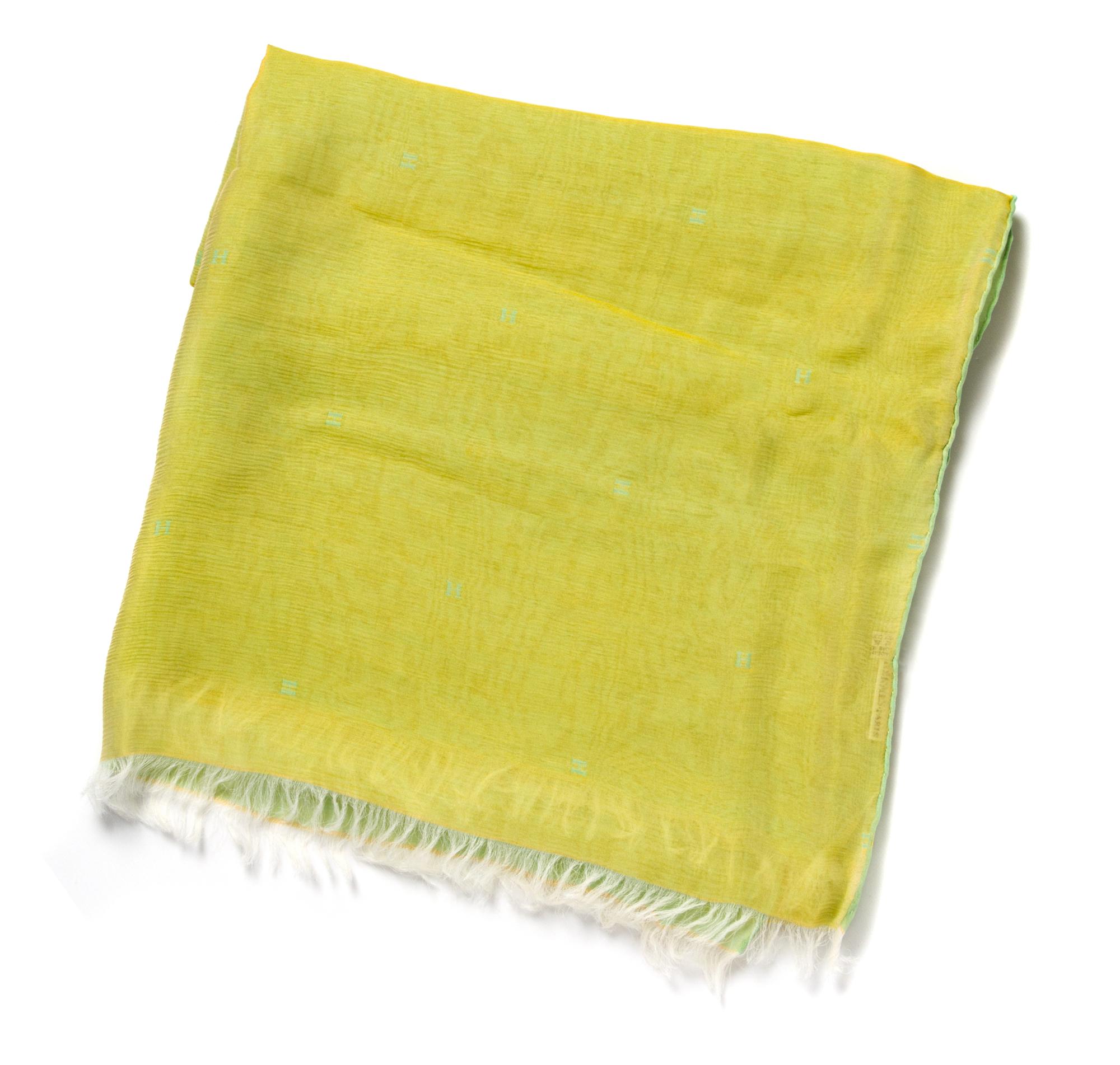 An Hermes Lime Silk Chiffon Oblong Scarf, 68 x 26 inches.