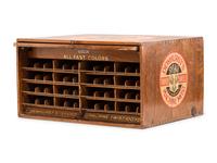 A Dewhurst's "Sylko" Stenciled Oak Spool Cabinet