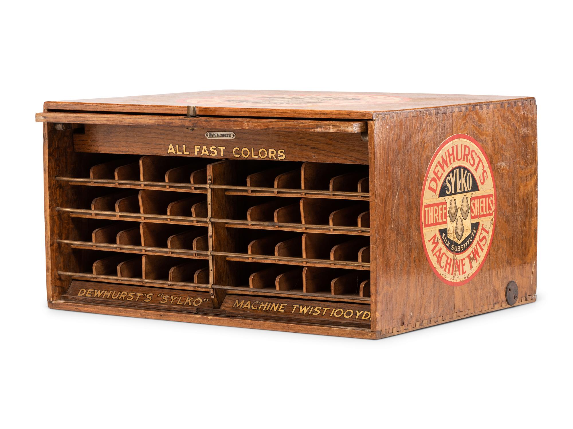 A Dewhurst's "Sylko" Stenciled Oak Spool Cabinet