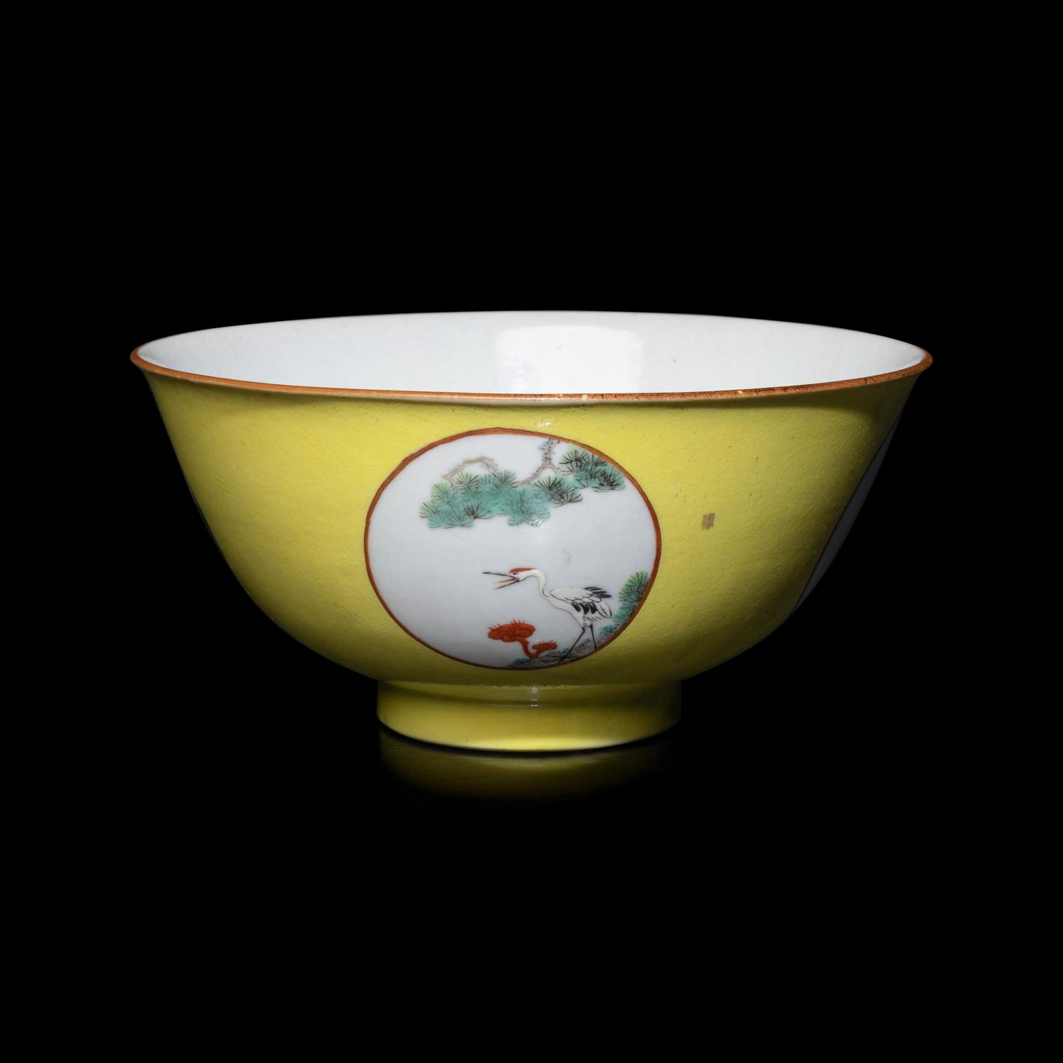 A Chinese Yellow Ground 'Medallion' Porcelain Bowl, Qing Dynasty, 18th Century or Later 清中期 黃地粉彩開光松鶴延年圖碗